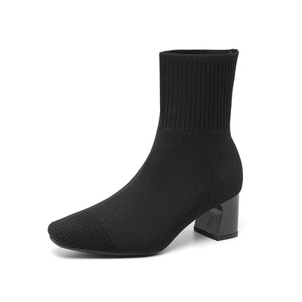 Black sock boot on a white background