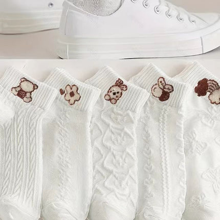 White socks with brown bear designs on a white background