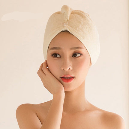 Woman wearing a beige towel on her head