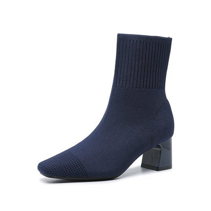 Navy sock boot on a white background