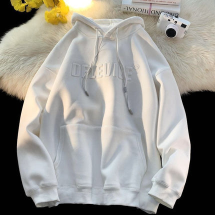 White hoodie with brand logo on a textured surface