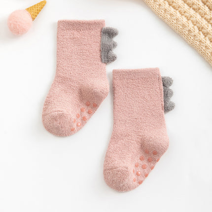 Pair of pink socks with gray toes on a white background