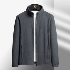 Gray jacket on a hanger against a light gray background