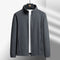 Gray jacket on a hanger against a light gray background