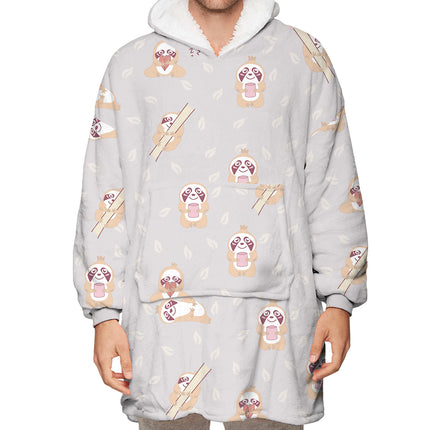 Person wearing a gray hoodie with cartoon dog pattern on a white background