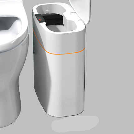 Modern toilet with a small additional unit next to it in a bathroom setting.