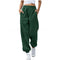 Green baggy pants worn by a person on a white background