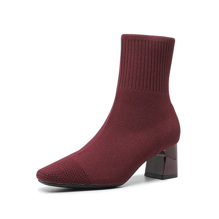 Maroon sock boot on a white background