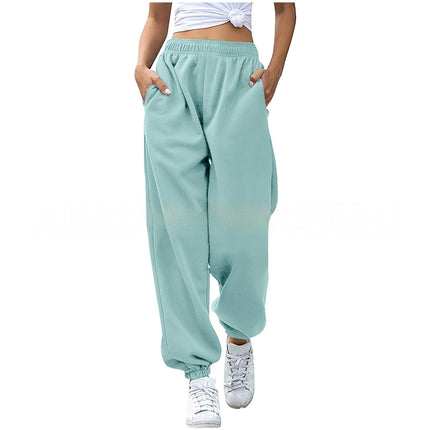 Light blue sweatpants worn by a person on a white background