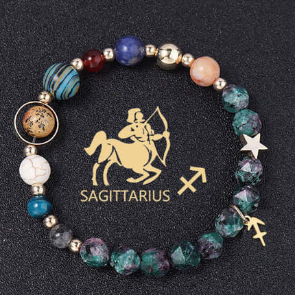 Beaded bracelet with star sign charm on a black background with Sagittarius symbol