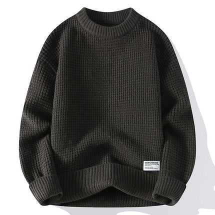 Loose-fitting dark pullover sweater with textured fabric, designed for autumn and winter fashion.