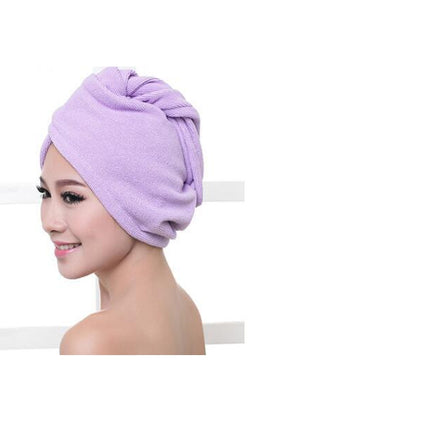 Woman wearing a purple hair towel
