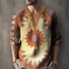 Man wearing a patterned shirt with a decorative center design on a plain background