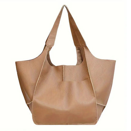 Tan leather tote bag on a white background