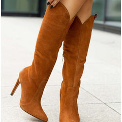 Brown suede knee-high boots on a light background