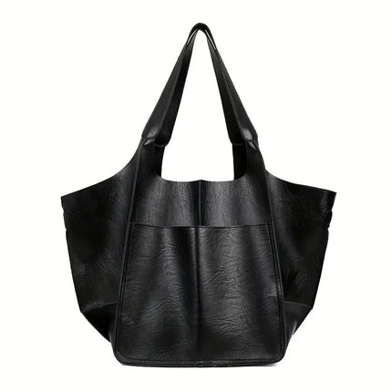 Black leather tote bag on a white background