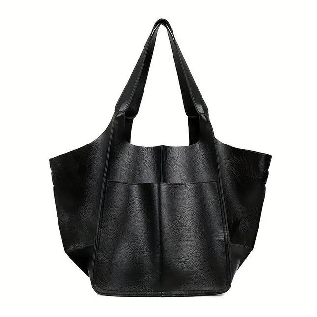 Black leather tote bag on a white background