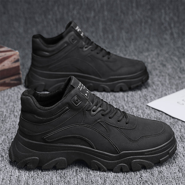 Black high-top sneakers on a textured gray surface