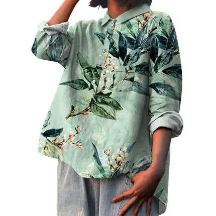 Person wearing a light green shirt with floral pattern on a white background