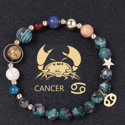 Beaded bracelet with Cancer zodiac symbol on a black background