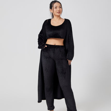 Woman wearing a black outfit on a white background