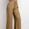 Brown pants with a drawstring waist on a light gray background