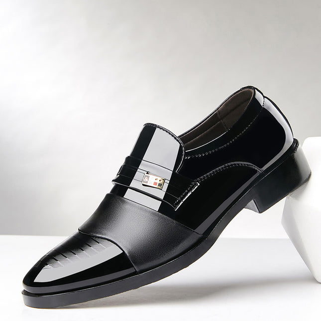 Black dress shoe with a silver buckle on a white background