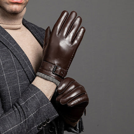 Person wearing brown leather gloves with a gray background