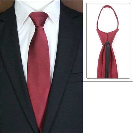 Maroon tie with knot-free zipper feature on a suit.