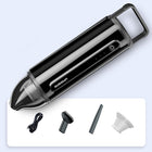 Black and silver hair trimmer with accessories on a light gray background