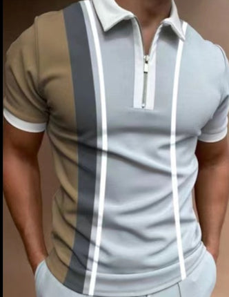 Man wearing a stylish polo shirt with color-blocked design on a plain background