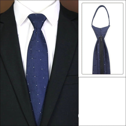Navy blue tie with white polka dots on a suit, featuring a zipper mechanism.