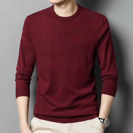 Maroon sweater worn by a person on a gray background