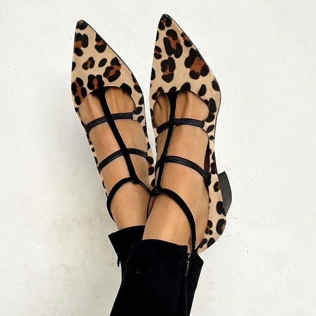 Leopard print flats with black straps on a white background