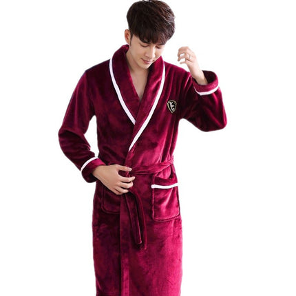 Man wearing a red robe with white trim on a white background