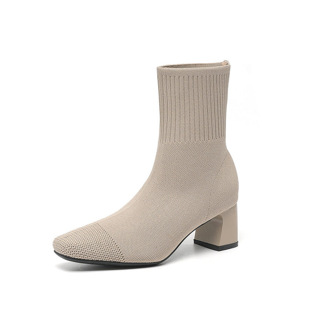 Beige sock boot on a white background