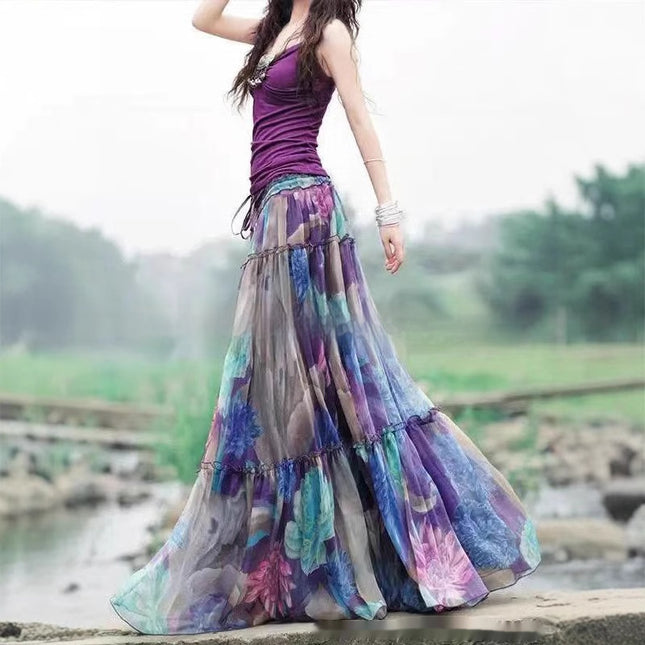Woman wearing a colorful long skirt with a blurred natural background