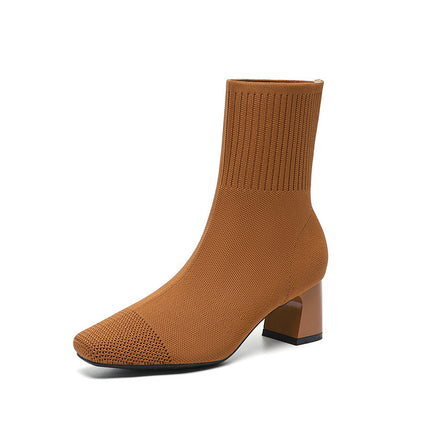Brown sock boot on a white background