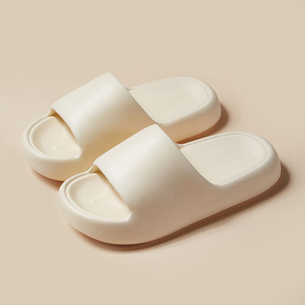 Pair of white slippers on a beige background