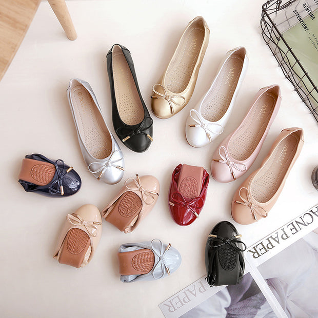 Colorful assortment of foldable ballet shoes with soft bottoms and bows in various shades on a stylish background.
