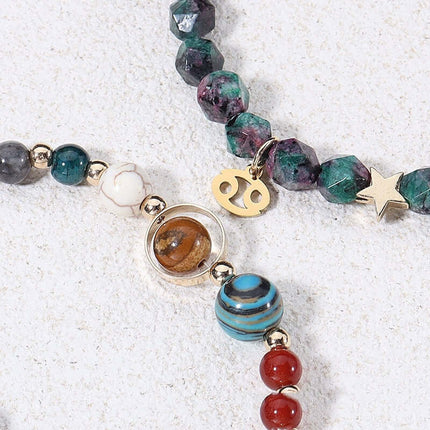 Natural stone bracelets showcasing zodiac signs, featuring colorful beads and gold accents on a light background.