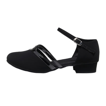 Black dance shoe with a strap on a white background