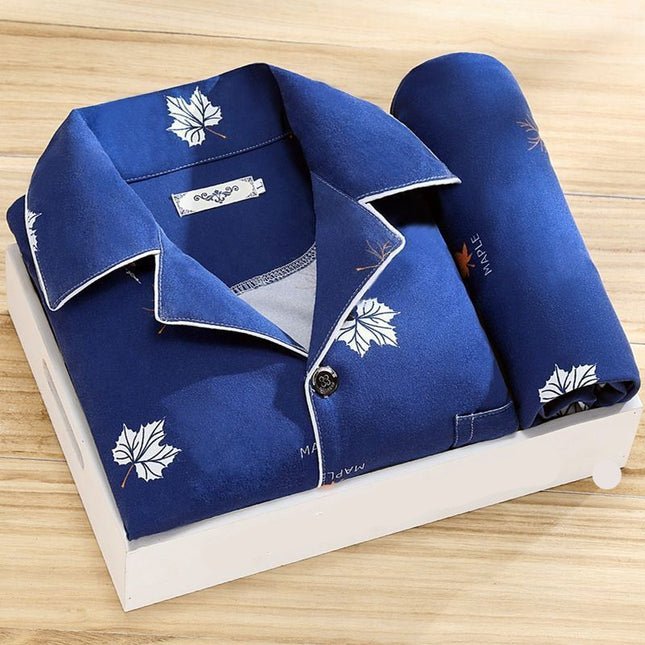Blue pajama set with leaf patterns on a white box labeled 'ORIGINALS' on a wooden surface.