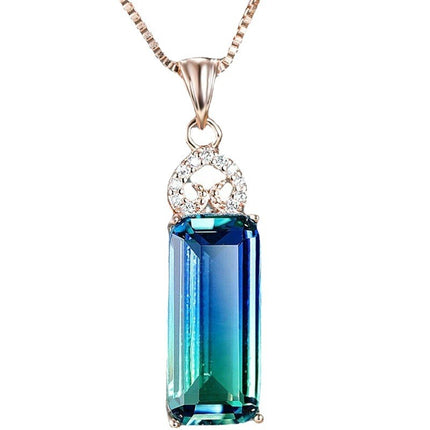 Jewelry necklace with a blue gemstone pendant on a white background