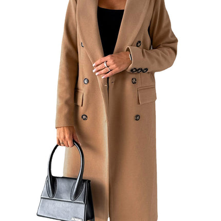 Person wearing a beige coat holding a black handbag on a white background
