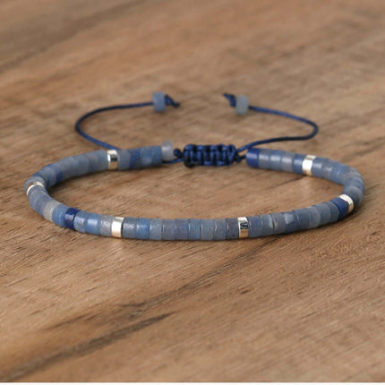 Hand-woven spacer bead bracelet in blue with silver accents, adjustable for women's fashion jewelry.