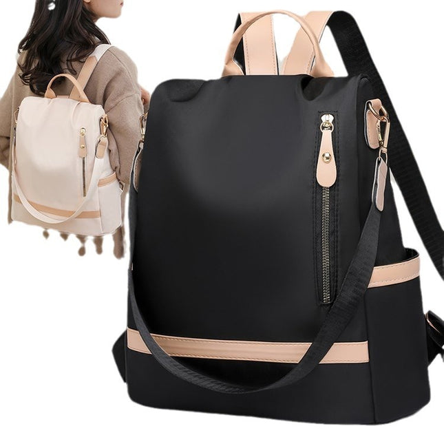 Black backpack with beige accents on a white background