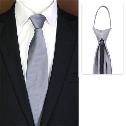 Gray tie with knot-free zipper feature on a suit.