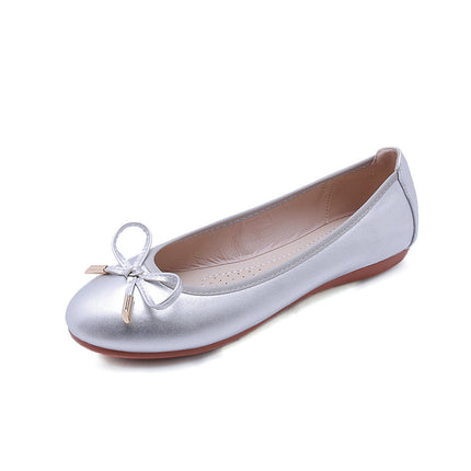 Silver foldable ballet shoes with soft bottom and bow detail, perfect for work or casual wear.